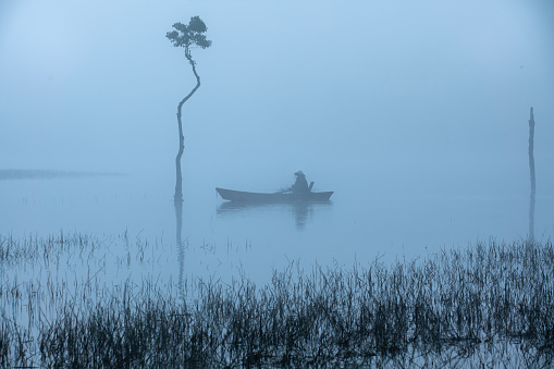 Foggy morning in Tuyen Lam lake, Dalat, Lam Dong province, central highlands Vietnam