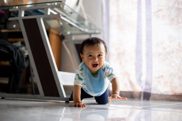 istock Baby crawling very happily 1334381541