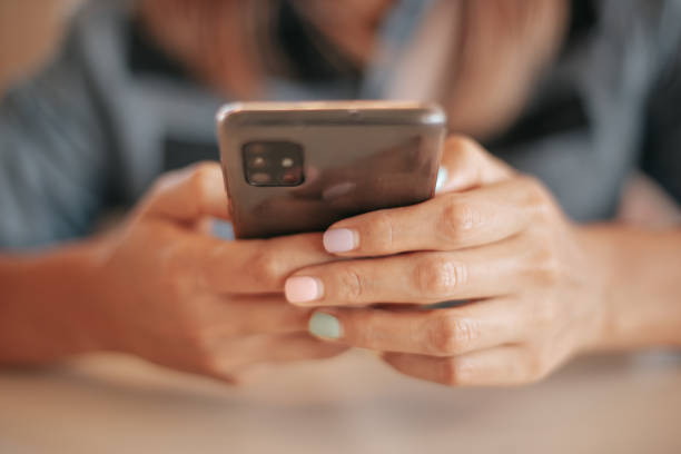istock Young woman using her cell phone 1334382263