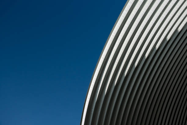 istock contemporary white grey metal curve architecture on blue sky background 1334383304
