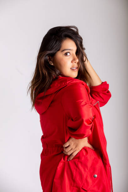 istock Young woman wearing jeans and red jacket 1334384229