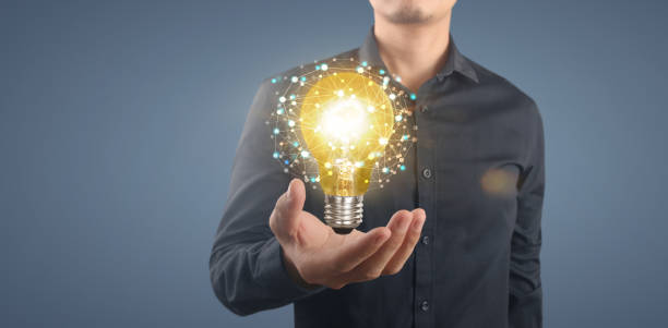 istock Hand of holding illuminated light bulb,  innovation inspiration concept 1334384946