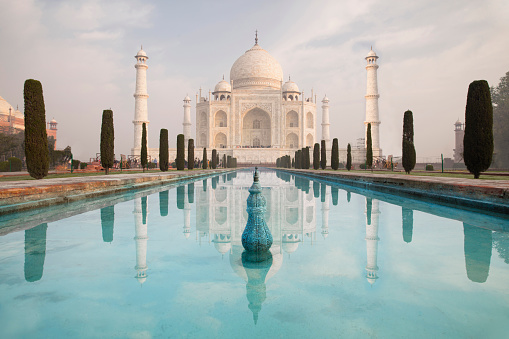 Reflection fountain of Taj Mahal at sunrise before the fountains are turned on.