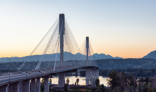 Port Mann Bridge over the Fraser River. Sunny Summer Sunset. Surrey, Vancouver, British Columbia, Canada.