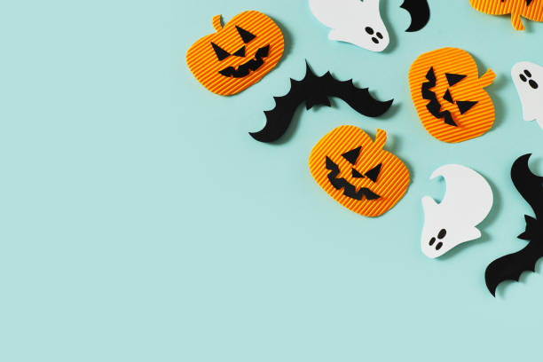 istock Halloween party concept with fun paper decor, pumpkins, ghost 1334390518