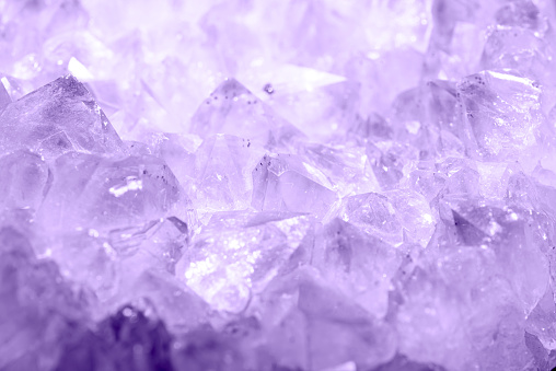 Detail of natural crystal patterns in lilac color. Abstract image with random patterns.