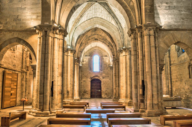 nave of the church inside the monastery of santa maria la real in the village of aguilar de campoo, spain - church indoors inside of monastery imagens e fotografias de stock