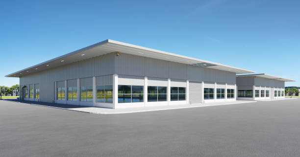 istock Modern new factory building with empty asphalt floor 1334396471