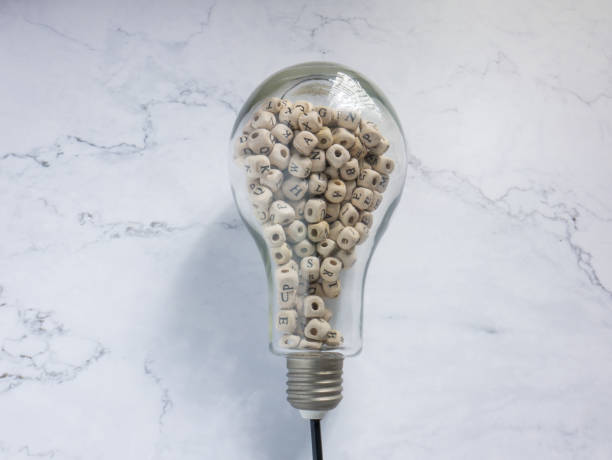 istock light bulb and alphabet wood cube on white marble for idea or think concept 1334397866