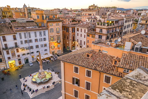 A breathtaking view of the roofs and terraces of Rome from the top of the Pantheon district, in the Rione Pigna (Pigna Village), in the historic heart of the Eternal City. Below the Baroque fountain designed in 1575 by Giacomo della Porta and the Egyptian obelisk in Piazza della Rotonda (Piazza del Pantheon). In 1980 the historic center of Rome was declared a World Heritage Site by Unesco. Image in high definition format.