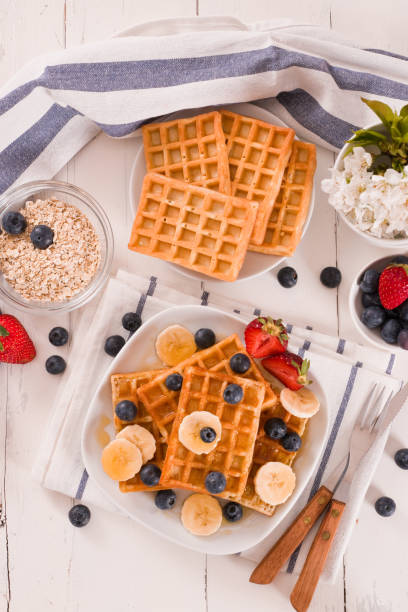 istock Waffles with blueberries, bananas and honey. 1334400240