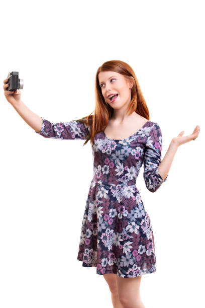 istock Beautiful young woman taking a selfie or vlogging 1334400265