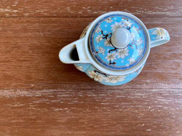 istock Chinese style teapot with blue flower pattern put on the table 1334400280