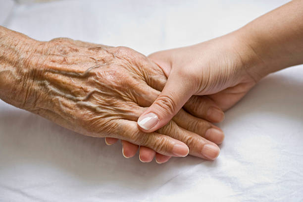 3,600+ Hands Clasped Human Hand Senior Adult Old Stock Photos and