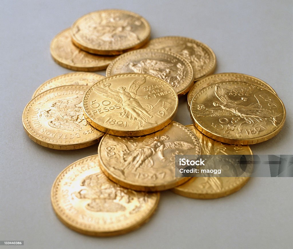 Some coins of 50 pesos gold Mexican Centenario, is a coin of 37.5 gr. of pure gold Gold - Metal Stock Photo