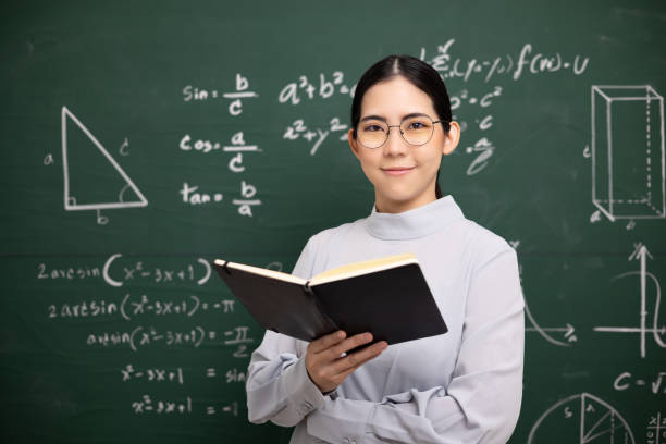 istock Young asian teacher woman teaching holding book 1334405874