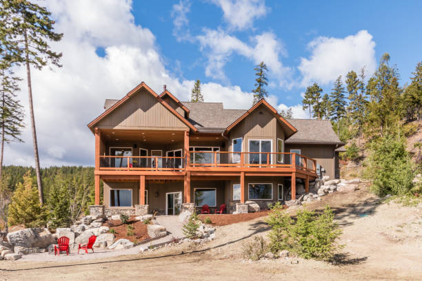 istock Two story home on sloped hill 1334406944