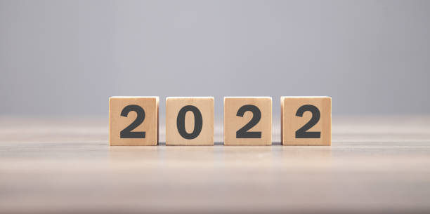 istock 2022 with cube on the table. Happy new year 1334408752