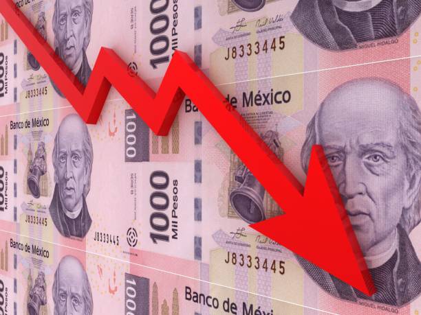 istock Mexican money peso falling finance crisis 1334408960