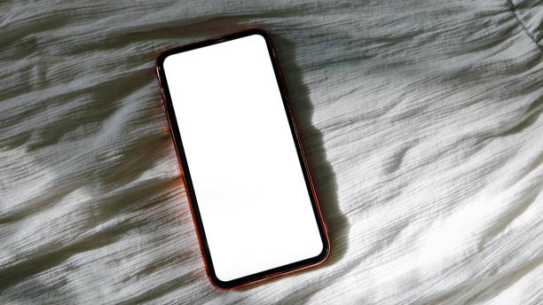 istock Women's hands holding cell telephone blank copy space screen. smartphone with blank white screen isolated on white background . smart phone with technology concept 1334408973