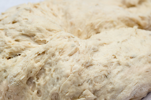 raw yeast dough on table closeup