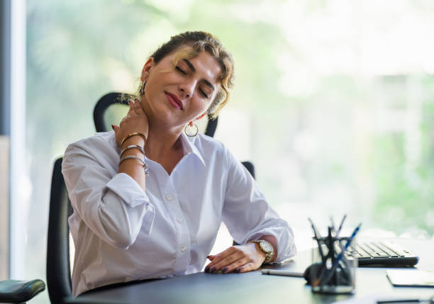 istock Businesswoman Having Neck Ache Due To Work Over Load And Bad Posture 1334412991