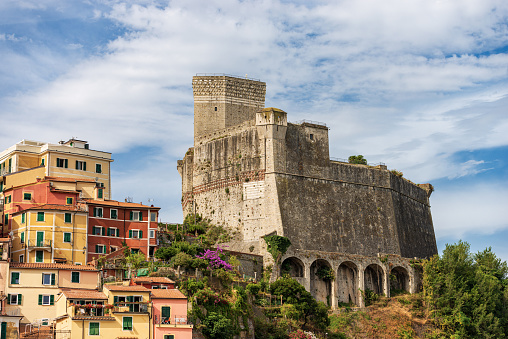 Lerici, La Spezia, Liguria, Italy - July 8th, 2021: Closeup of the ancient Castle of Lerici town (1152-1555). Tourist resort on the coast of the Mediterranean sea (Ligurian Sea), Gulf of La Spezia, Italy, Europe. It is a polygonal fortification that stands in a dominant position on the rocky promontory of Lerici inlet.