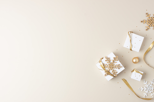 Christmas gift boxes on white wooden background with copy space