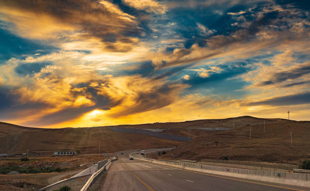 istock Colorful sunset sky over the road 1334417227