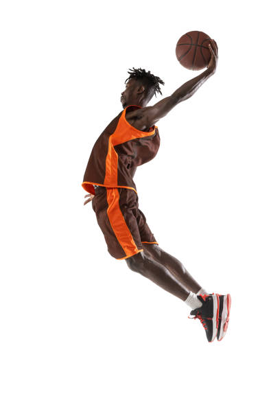 istock One young african man, basketball player training with ball isolated over white studio background. 1334418588