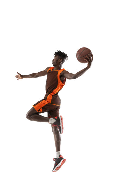 istock One young african man, basketball player training with ball isolated over white studio background. 1334418591