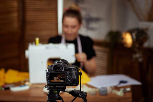 istock seamstress blogger shooting with camera for blog 1334418597