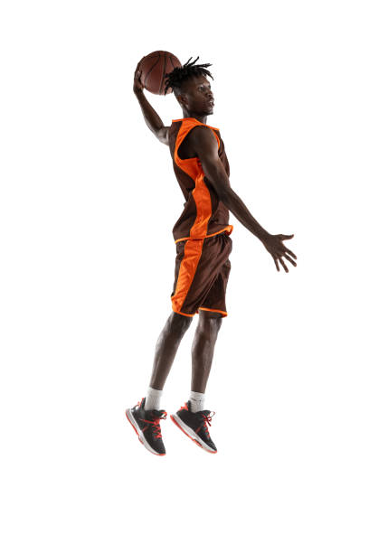 istock One young african man, basketball player training with ball isolated over white studio background. 1334418611