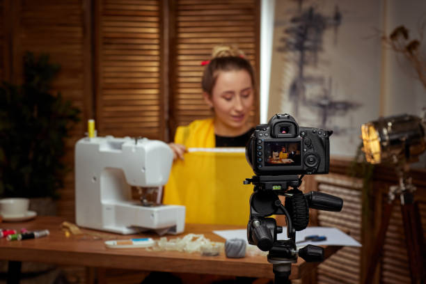 istock seamstress blogger shooting with camera for blog 1334418682