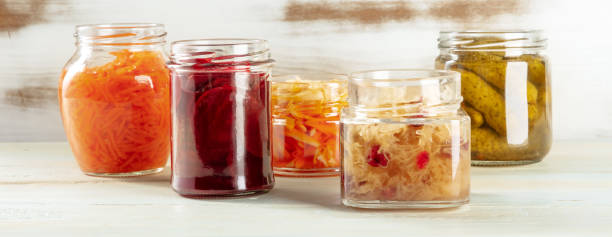 istock Fermented food panorama. Canned vegetables. Pickles, sour cabbage etc 1334419983