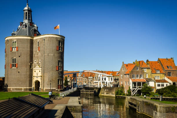 The historical villages of Hoorn and Enkhuizen in Holland Enkhuizen, the Netherlands - September 2, 2020.. View of  the harbour of Enkhuizen with the historic gatehouse and the drawbridge. enkhuizen stock pictures, royalty-free photos & images