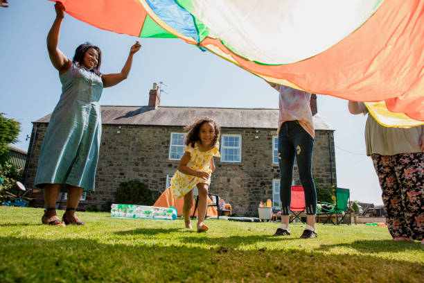 istock Playing with the Parachute in the Garden 1334422121