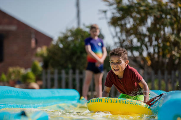 istock Playing on a Slip n Slide 1334422179