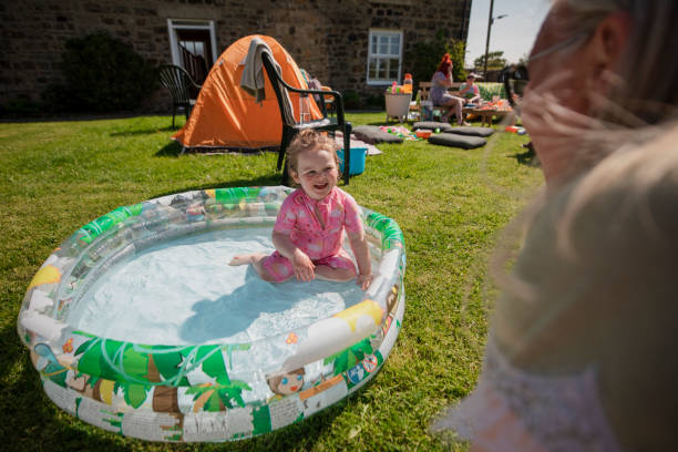 istock Playing in the Paddling Pool 1334426780