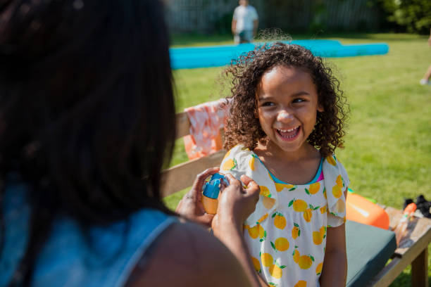 istock Putting Suncream on her Daughter 1334426781