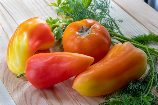 Capsicum annuum. Closeup, wooden background. Advertising background -  for menu,\non topics about fresh vegetables