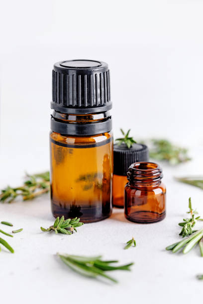 istock Rosemary and thyme sprigs with dark glass jar. 1334429185