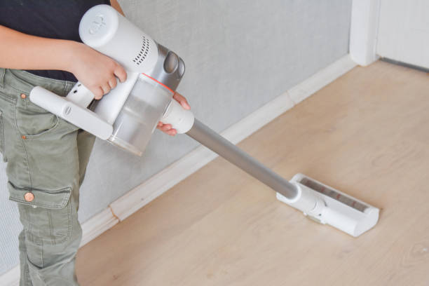 istock child girl does vacuuming in the house 1334429962