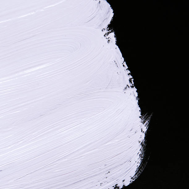 istock White Brush strokes paint on black background. Minimal abstract creative texture 1334430368