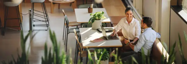 Photo of Business partners having meeting in coworking office space