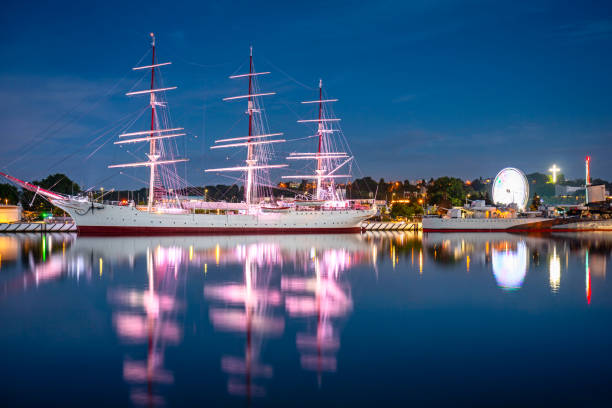 istock Harbor in Gdynia with the sailboat at dusk 1334433577