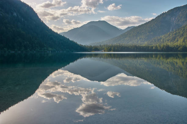 istock Mirroring mountain lake during sunrise. 1334434490