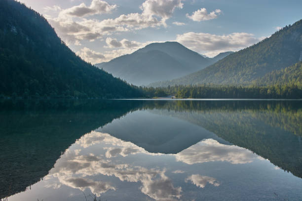 istock Mirroring mountain lake during sunrise. 1334434491