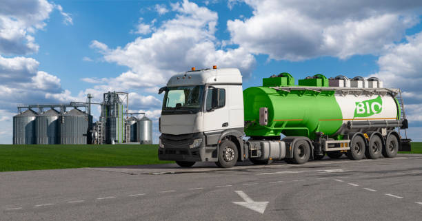 truck with a tank with the inscription bio on the background of silos. - biodiesel imagens e fotografias de stock