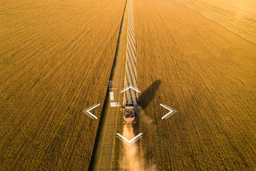 Autonomous harvester working on the field. Smart farming